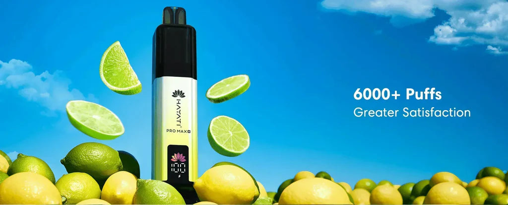 Hayati Pro Max Lemon Lime Disposable Vape – A promotional banner showing the white Hayati Pro Max vape surrounded by fresh lemons and limes under a clear blue sky.