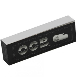 A black and silver OCB branded rolling paper tip for cigarettes.