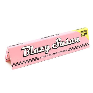 Packaging for Blazy Susan Kingsize Slim Pink Rolling Papers with a pink color scheme and checkered pattern.