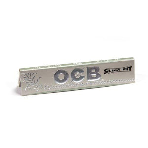 A pack of OCB X-Pert Rolling Papers Slim with branding and design visible on the packaging.