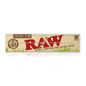 Packaging for Raw Organic Hemp Rolling Papers, showing the brand logo and the text 'Organic Hemp', 'RAW', and 'Natural Unrefined Hemp Rolling Papers'. The background is beige with green accents resembling grass.