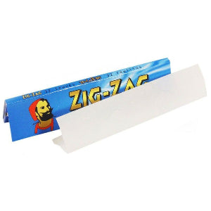 A pack of Zig-Zag brand rolling papers with a blue and red design, featuring an illustration of a character on the front.